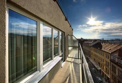 an apartment balcony with a view of a city at Residence BENE in Prague