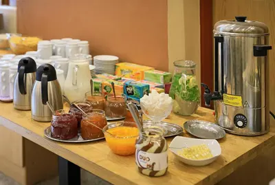 a counter top with various food items on it at Residence BENE in Prague