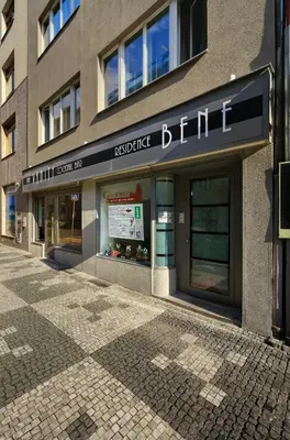 a building with a sign on the front of it at Residence BENE in Prague