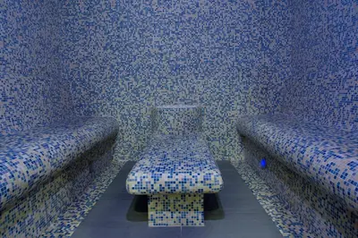 a room with two chairs with a bench in it at Clarion Congress Hotel Prague in Prague