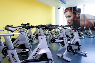 a row of exercise bikes in a gym at Clarion Congress Hotel Prague in Prague
