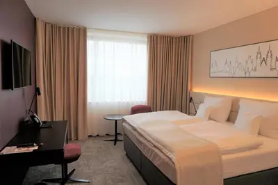 a hotel room with a bed and a desk at Clarion Congress Hotel Prague in Prague
