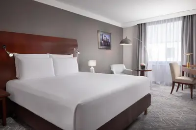 a hotel room with a bed and a bathroom at Hilton Prague Old Town in Prague