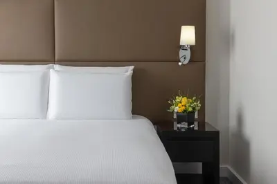 a hotel room with a bed and a couch at Hilton Prague Old Town in Prague