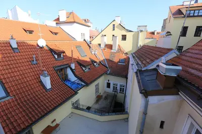 a view of roofs of buildings in a city at Hotel King George in Prague