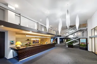a lobby of a building with a reception desk at Congress & Wellness Hotel Olsanka in Prague