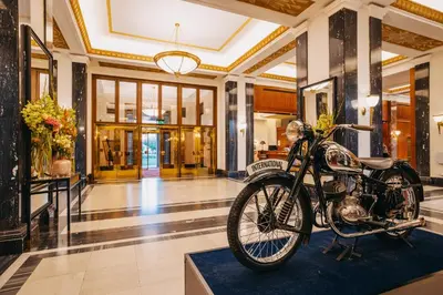 a motorcycle parked in the lobby of a building at Grand Hotel International - Czech Leading Hotels in Prague