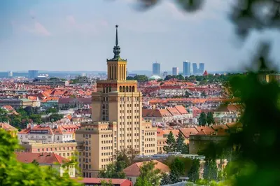 a large building with a tower on top of it at Grand Hotel International - Czech Leading Hotels in Prague