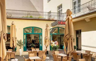 a restaurant with closed umbrellas in front of a building at VN48 Suites by Adrez in Prague