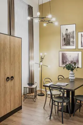a dining room with a table and chairs at VN48 Suites by Adrez in Prague