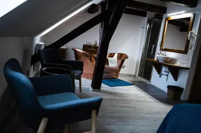 a room with chairs and a sink and a mirror at U Medvidku-Brewery Hotel in Prague