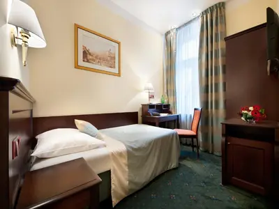a hotel room with a bed and a television at EA Hotel Downtown in Prague