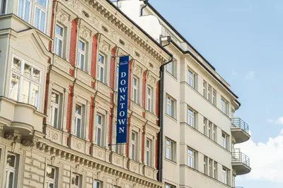 a building with a blue sign on the side of it at EA Hotel Downtown in Prague