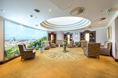 a large room with chairs and a large window at Lindner Hotel Prague Castle, part of JdV by Hyatt in Prague