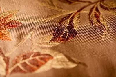 a close up of a curtain with leaves on it at Hotel Questenberg in Prague