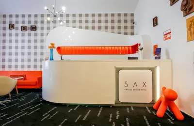 a large white appliance with an orange bear next to it at LH Vintage Design Hotel Sax in Prague