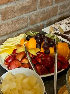 a large kitchen with a brick wall at Hotel Astra in Prague