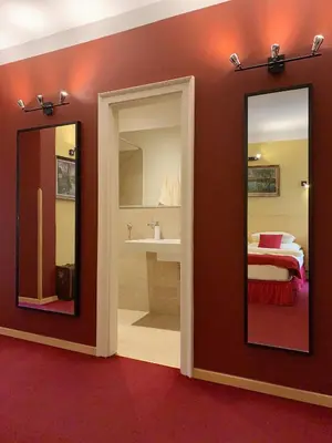 a bedroom with a mirror and a bed and a sink at Small Luxury Palace Residence in Prague