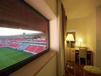 a room with a view of a baseball stadium at Iris Hotel Eden - Czech Leading Hotels in Prague