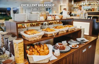 a bakery with many different types of bread and pastries at Iris Hotel Eden - Czech Leading Hotels in Prague