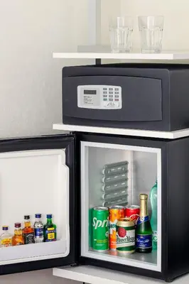 an open microwave oven with drinks in it at Metropol Design Hotel Old Town in Prague
