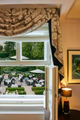 a window in a room with a view of a patio at The Grand Mark Prague - The Leading Hotels of the World in Prague