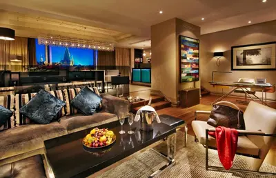 a living room with a couch and a table at The Grand Mark Prague - The Leading Hotels of the World in Prague