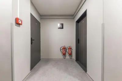 a hallway with two fire hydrants on the wall at Koruna Hotel in Prague
