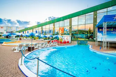 a large swimming pool in front of a building at Aquapalace Hotel Prague in Čestlice
