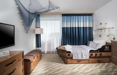 a bedroom with a bed and a tv in it at Aquapalace Hotel Prague in Čestlice