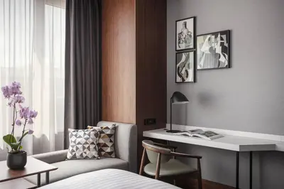 a hotel room with a bed and a desk and a chair at Prague Marriott Hotel in Prague
