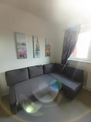 a living room with a couch and a glass table at Apartmán Tony Slapy in Slapy