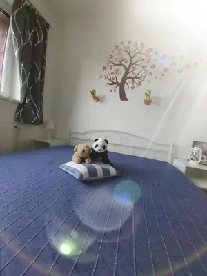 a bedroom with a bed with two teddy bears on it at Apartmán Tony Slapy in Slapy