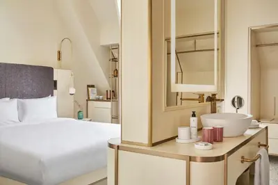 a hotel room with a bed and a sink at Andaz Prague, By Hyatt in Prague