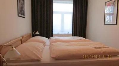 a bed with two pillows on it in a bedroom at Villa Jinonice in Prague