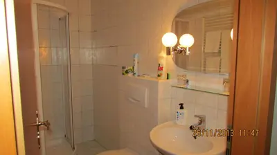 a bathroom with a shower and a sink at Villa Jinonice in Prague
