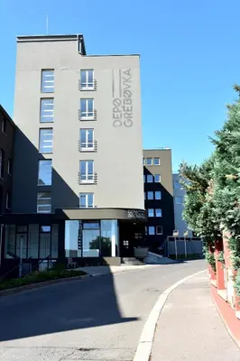 a building with a sign on the side of a street at Airstay Prague apartment: Grebovka in Prague