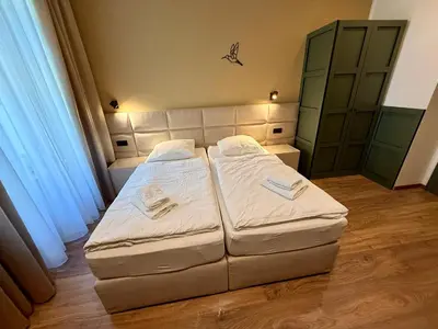 two beds in a small room with at Luxury Residence Kmochova in Prague