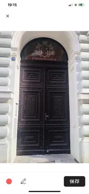 a large black door in an arch way at Charles Square Prague Apartment in Prague