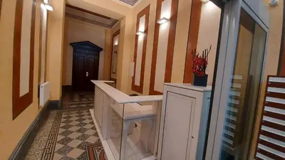 a hallway with a sink and a hallway with a door at quiet apartment in Prague center in Prague