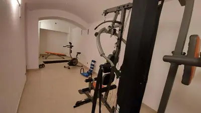 a room with a gym with exercise bikes in it at quiet apartment in Prague center in Prague