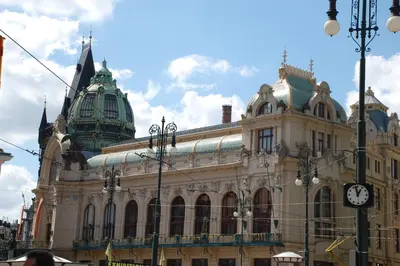 a large building with a clock on the side of it at Apartmany Chodov in Prague