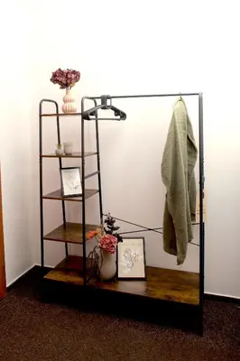 a mirror in a room with a shelf and a vase at Valnovka Wellness Hotel in Kamenice