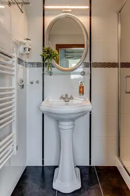 a bathroom with a sink and a mirror at Hotel Golfi in Poděbrady
