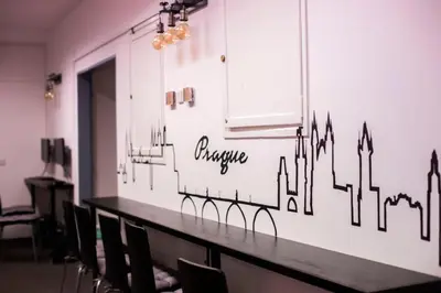 a long table in a room with chairs at Hostel V38 in Prague