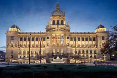 a large building with a tower on top of it at Hostel V38 in Prague