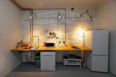 a kitchen with a counter and a white refrigerator at Peter's Tower Apartments in Prague