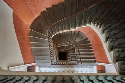 a spiral staircase in a building at Prague Days - Loft with Relax Zone near Vltava River in New Town in Prague