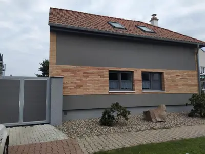 a house with a window and a roof at Ubytování na statku Račice in Račice