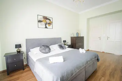 a bedroom with a large bed with two pillows at Apartmán Anastasie in Prague